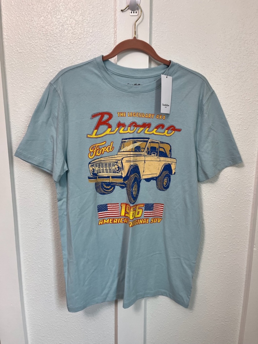 Good American Light Blue Bronco Graphic Tee with Yellow & Red Accents